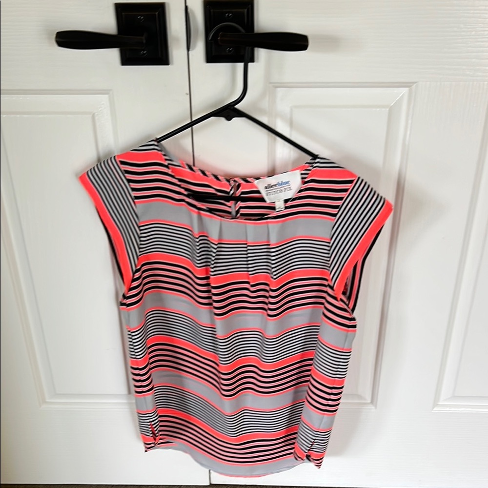 Black scoop neck cap sleeve blouse with a boxy relaxed style